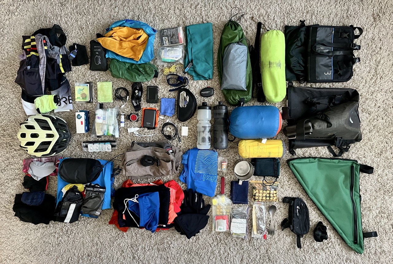 Bikepacking gear laid out on the floor